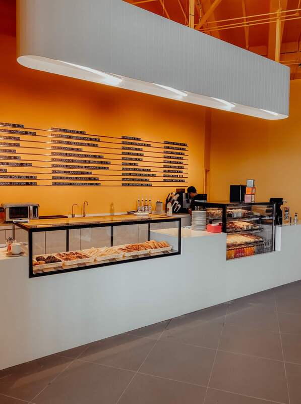 Grey tiled flooring installed in a bakery display and counter area