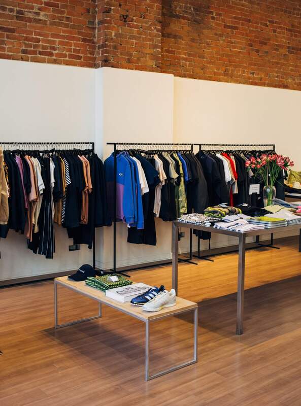 Tiled flooring in a retail store fit-out with exposed brick walls