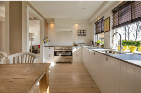 Kitchen with white subway tile splashback behind the stove
