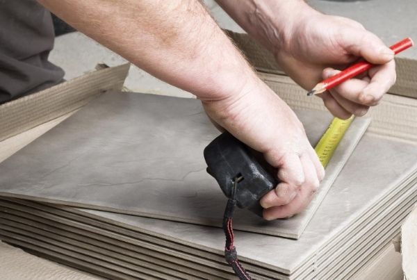 Tiling contractor properly measuring tile sizes