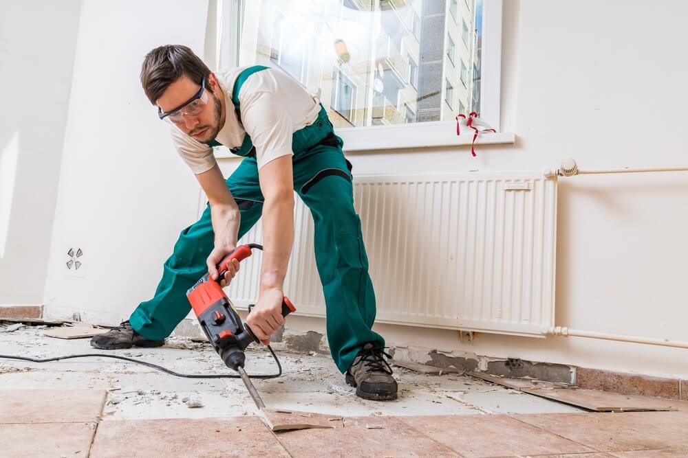 reliable tiler removing tiles using a drill